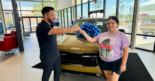 Woman Getting New Kia Keys from Casa Kia